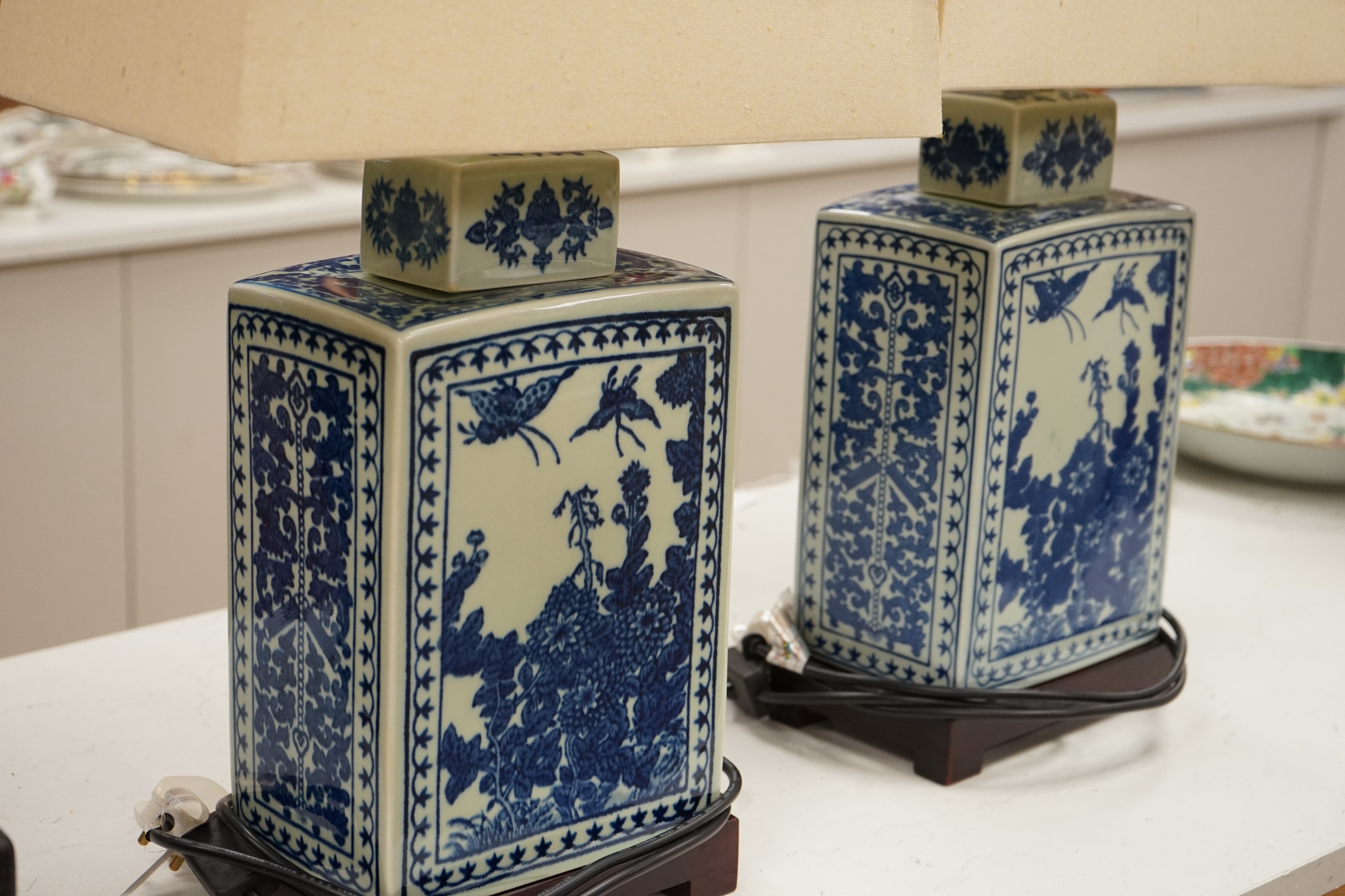 A pair of rectangular profile Japanese blue and white table lamps on stands, with shades, 59cm high. Condition - good